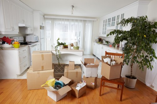 Movers transporting commercial items through a Forest Hill property