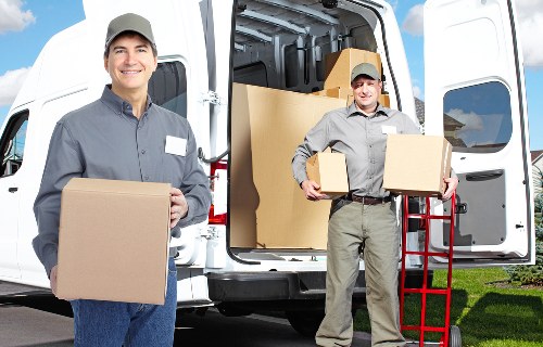 Careful loading of household items into a moving van