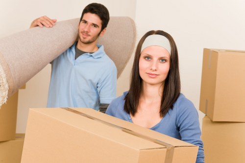 Mover preparing fragile items and furniture for transport in Forest Hill