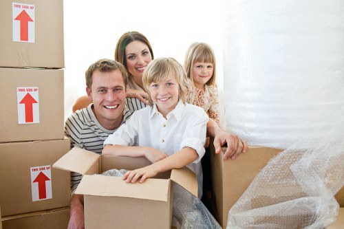 Local movers handling furniture in a Forest Hill property